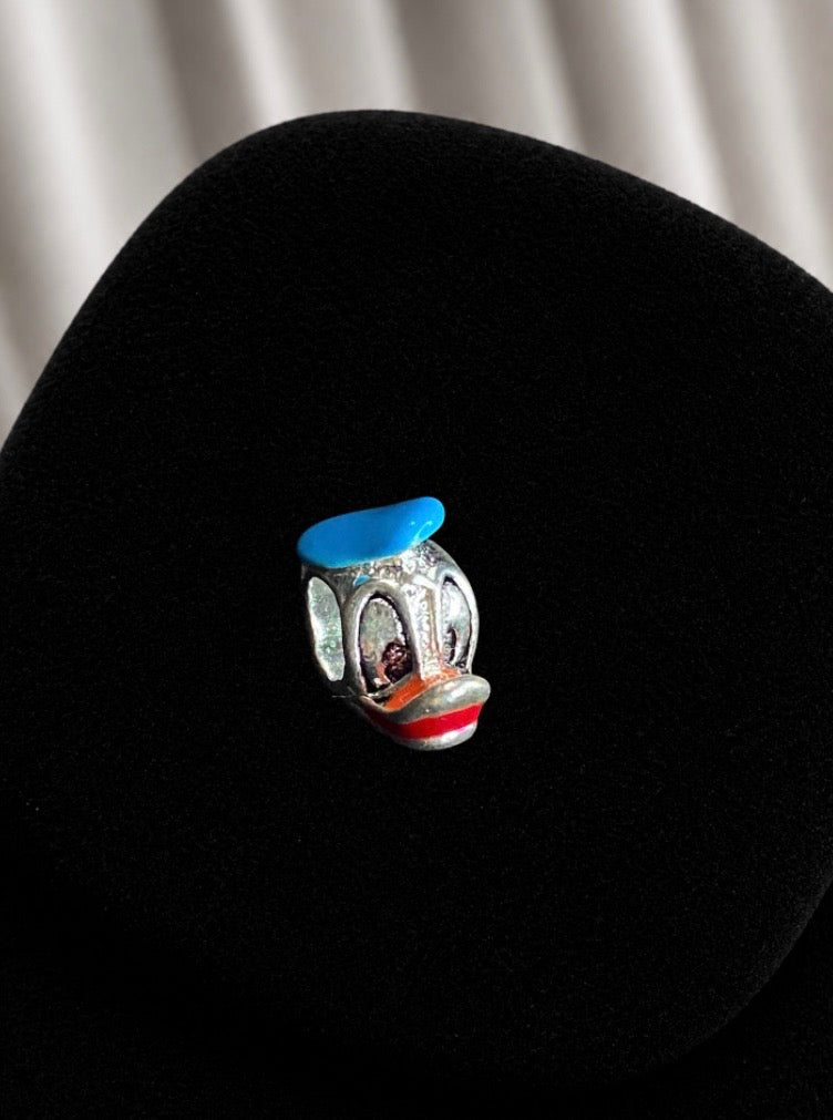 Charm exclusivo pato donald