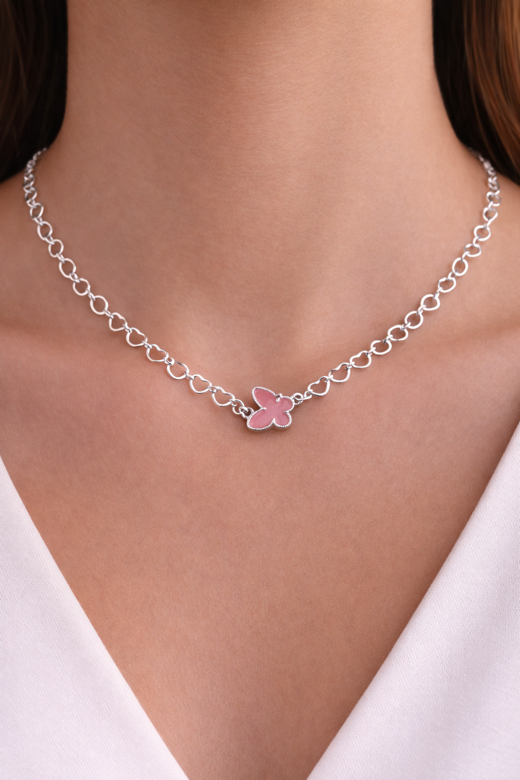 Cadena de corazones con mariposa